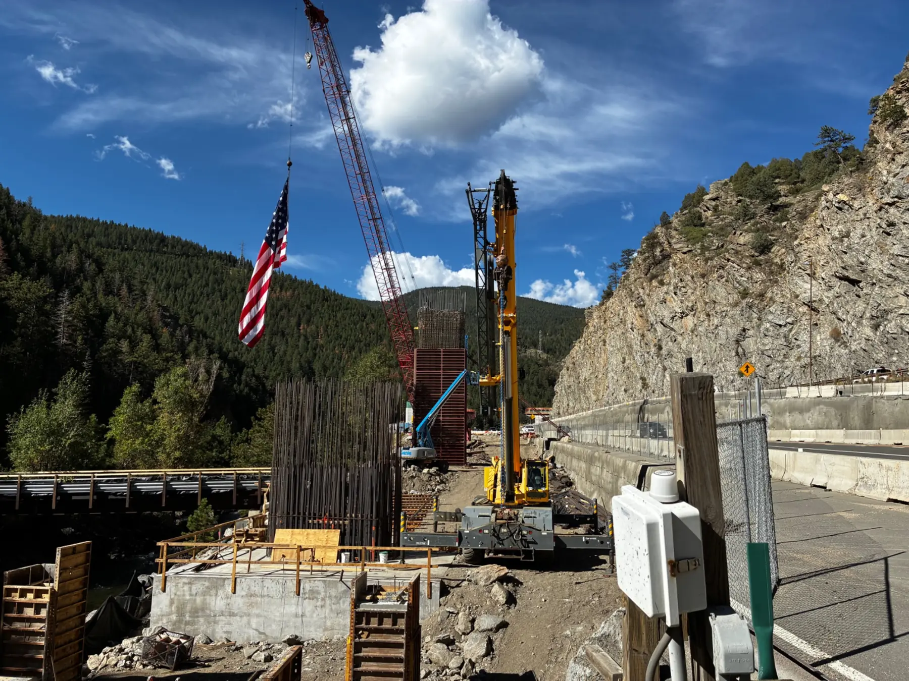 Bridge pier, rebar cage and pile-driving equipment at the Floyd Hill I-70 construction project